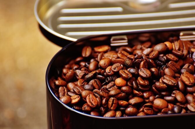 Coffee beans in a metal tin