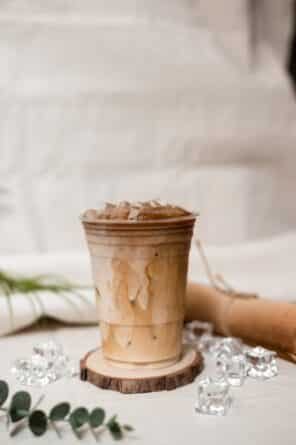transparent cup filled with ice coffee