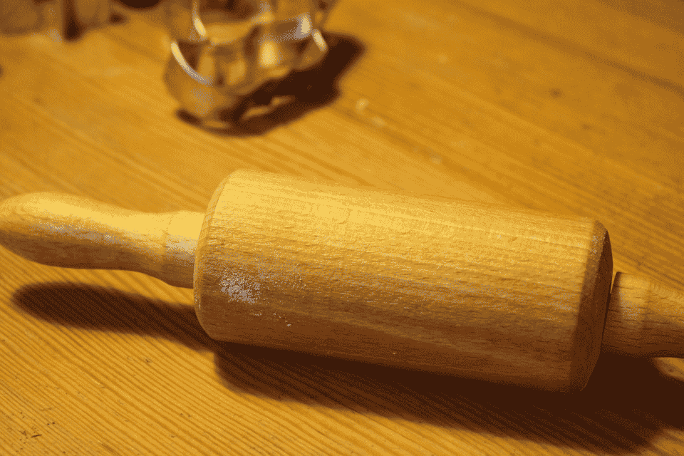 a rolling pin on a flat surface
